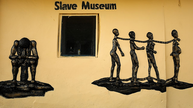 A bas-relief of shackled slaves is embedded in the wall of the Seriki Abass Slave Museum in Badagry, Nigeria June 19, 2019. The 400-year anniversary of the first slave boat to arrive in America from Africa has caused a rush of interest in heritage tourism in West Africa, as descendants of slaves from America, the Caribbean and Europe visit ancient sites to delve into a dark and often hidden past. Picture taken June 19, 2019. REUTERS/Afolabi Sotunde

