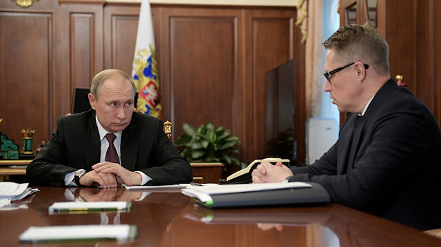 File photo: Russian President Vladimir Putin listens to Minister of Health Mikhail Murashko during a meeting on preventing the spread of coronavirus, in Moscow, Russia January 29, 2020. 