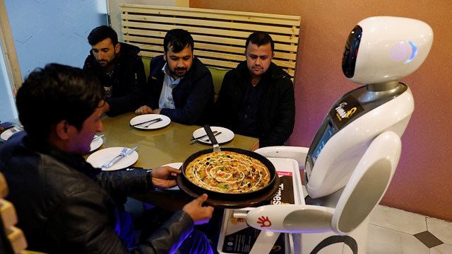 A waitress robot (Timia) delivers food to customers at the Times Fast Food restaurant in Kabul, Afghanistan February 11, 2020