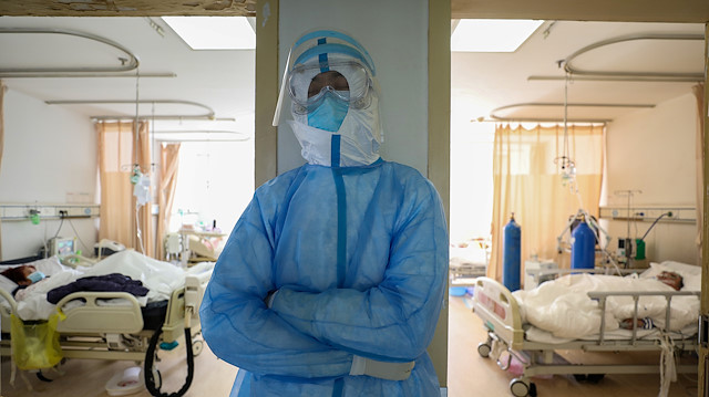 File photo: A medical worker in protective suit takes a break at an isolated ward of Wuhan Red Cross Hospital in Wuhan, the epicentre of the novel coronavirus outbreak, in Hubei province, China February 16, 2020