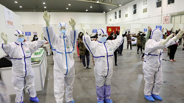 File photo: Medical workers in protective suits dance with patients inside the Wuhan Parlor Convention Center that has been converted into a makeshift hospital following an outbreak of the novel coronavirus, in Wuhan, Hubei province, China February 15, 2020