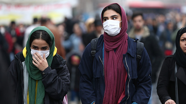 Iranian women wear protective masks to prevent contracting a coronavirus, as they walk at Grand Bazaar in Tehran, Iran February 20, 2020