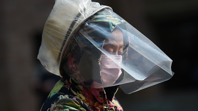File photo: A resident wears a makeshift protective face shield at a residential compound in Wuhan, the epicentre of the novel coronavirus outbreak, Hubei province, China February 21, 2020