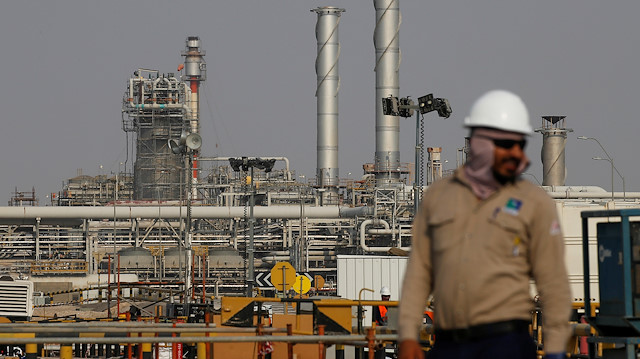 FILE PHOTO: An employee looks on at Saudi Aramco oil facility in Abqaiq, Saudi Arabia October 12, 2019.