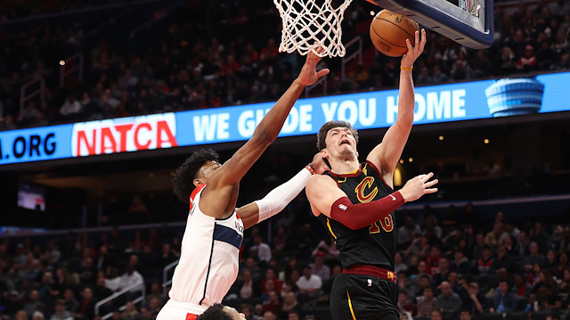 Feb 21, 2020; Washington, District of Columbia, USA; Cleveland Cavaliers forward Cedi Osman (16) shoots the ball as Washington Wizards forward Rui Hachimura (8) defends in the second quarter at Capital One Arena