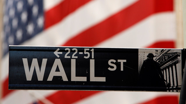 FILE PHOTO: A Wall Street sign is seen outside of the New York Stock Exchange 
