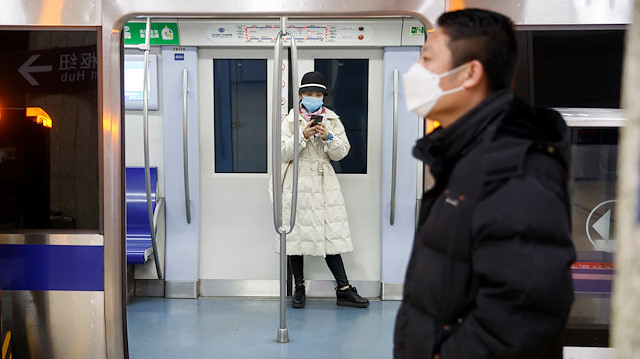 File photo: People wear face masks on the metro in Beijing as the country is hit by an outbreak of the novel coronavirus, China, February 24, 2020