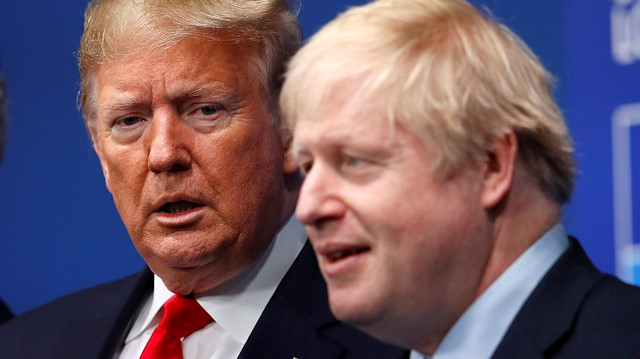 FILE PHOTO: Britain's Prime Minister Boris Johnson welcomes U.S. President Donald Trump