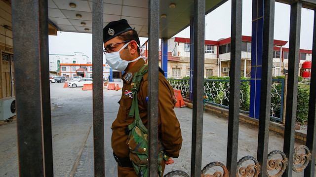 File photo: An Iraqi security officer wears a protective mask at a hospital, following the outbreak of the new coronavirus, in the holy city of Najaf, Iraq February 24, 2020