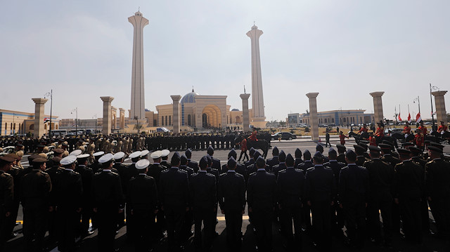 Guards participate in the funeral of former Egyptian President Hosni Mubarak east of Cairo, Egypt February 26, 2020.