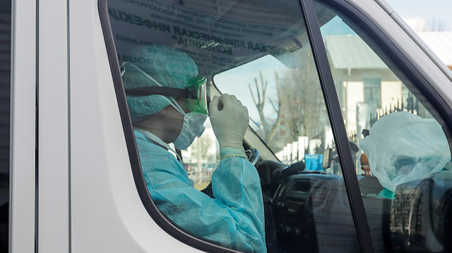 File photo: A medical worker in a protective suit is seen inside an ambulance at a hospital for infectious diseases, after Belarus registered the first case of coronavirus infection in the country, in Minsk, Belarus