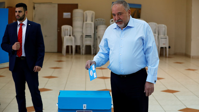 Avigdor Lieberman, leader of the ultranationalist Yisrael Beitenu party, prepares to cast his ballot 