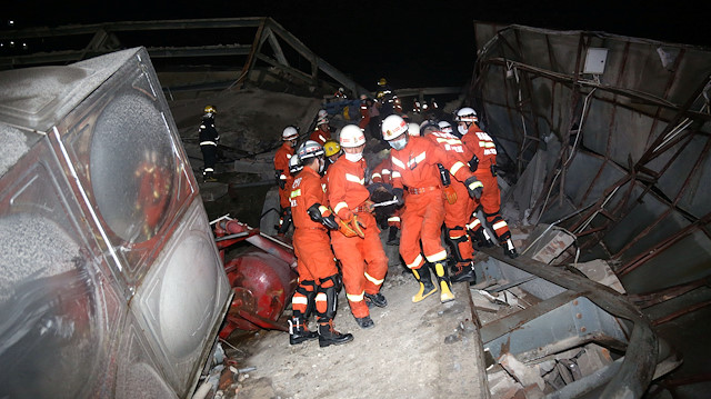 Rescue workers move casualty on the site where a hotel being used for the coronavirus quarantine collapsed, as the country is hit by the novel coronavirus, in the southeast Chinese port city of Quanzhou, Fujian province, China 