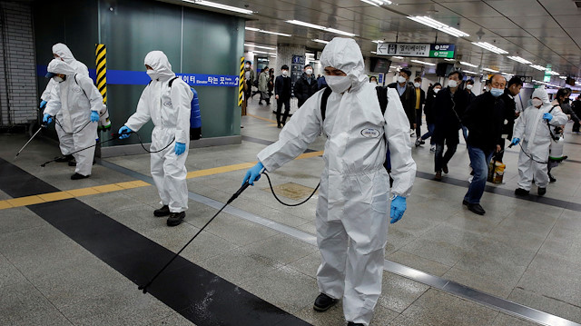 Employees from a disinfection service company sanitize a subway station amid coronavirus  outbreak