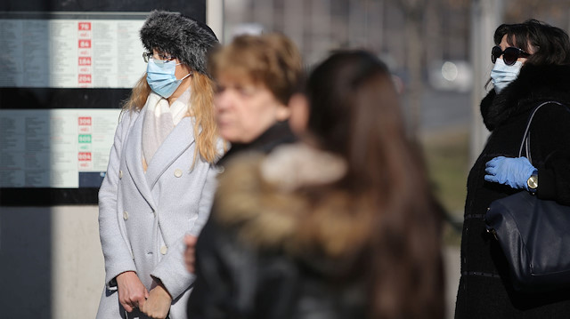 Two Bulgarian women wearing protective masks are seen in Sofia downtown
