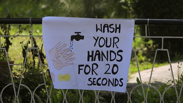 A sign is put up near a stall during an awareness compaign by an NGO