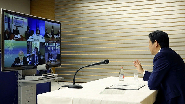 Japan's Prime Minister Shinzo Abe talks with other G7 leaders during a video conference at his official residence in Tokyo, Japan March 16, 2020, in this photo released by Japan's Cabinet Public Relations Office via Kyodo March 17, 2020. Picture taken March 16, 2020. 