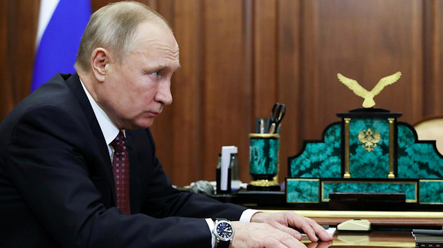 Russian President Vladimir Putin attends a meeting with head of the Central Election Commission 