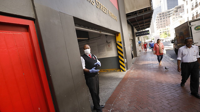 A secuity guard wears a mask for protection against the coronavirus on the streets of Cape Town, South Africa March 17, 2020. REUTERS/Mike Hutchings

