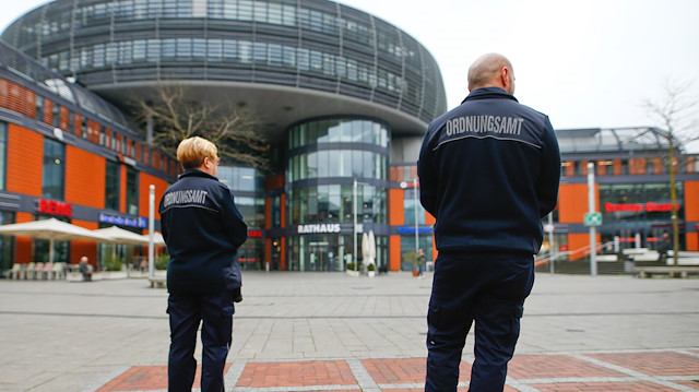 Employees of the Public order office patrol during a partial lockdown in Leverkusen