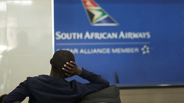 File photo: A passenger is seen at the South African Airways (SAA) customer desk, after SAA announced that it would immediately suspend all intercontinental flights until May 31 in response to a government travel ban aimed at stopping the spread of the coronavirus disease (COVID-19), at the O.R. Tambo International Airport in Johannesburg, South Africa March 20, 2020