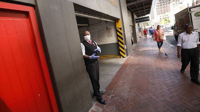 File photo: A secuity guard wears a mask for protection against the coronavirus on the streets of Cape Town,
