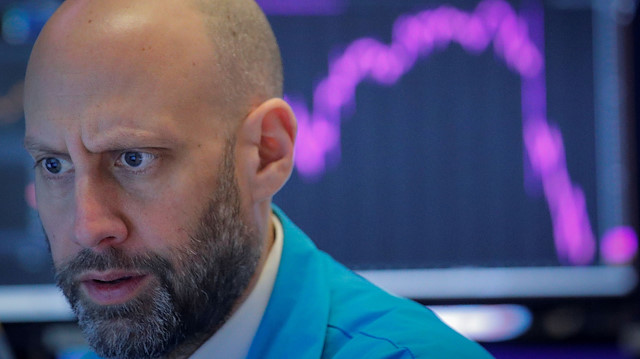 A trader works on the floor of the NYSE on Feb 27, 2020. Wall Street's main indexes 