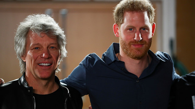 FILE PHOTO: Britain's Prince Harry and Jon Bon Jovi pose for a picture with choir members during a visit at Abbey Road Studios in London, Britain February 28, 2020. REUTERS/Hannah McKay/Pool/File Photo

