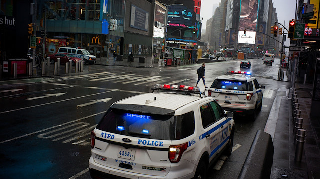New York Police cars patrol Times Square as the coronavirus disease (COVID-19) outbreak 
