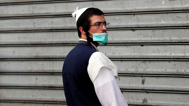 A Jewish ultraorthodox man wears a face mask amid coronavirus disease (COVID-19) 