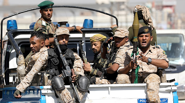 FILE PHOTO: Houthi troops ride on the back of a police patrol truck after participating in a Houthi gathering in Sanaa, Yemen February 19, 2020. REUTERS/Khaled Abdullah/File Photo

