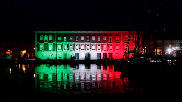 File photo: The Navy base is seen illuminated with the colours of the Italian flag, as Italy struggles to contain the spread of coronavirus disease (COVID-19), in Naples, Italy