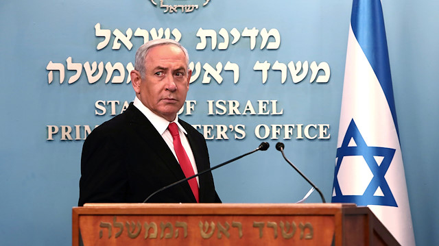 FILE PHOTO: Israeli Prime Minister Benjamin Netanyahu delivers a speech at his Jerusalem office, regarding the new measures that will be taken to fight the coronavirus, March 14, 2020. Gali Tibbon/Pool via REUTERS/File Photo

