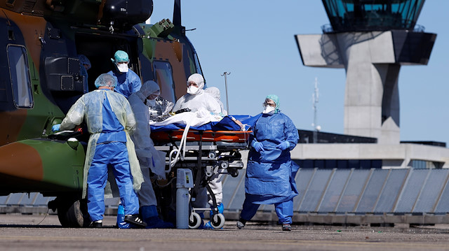 File photo: A patient, infected with coronavirus disease (COVID-19), is carried on a stretcher into a Caiman helicopter from the French army during transfer operations from Strasbourg to Germany and Switzerland, France March 30, 2020. 