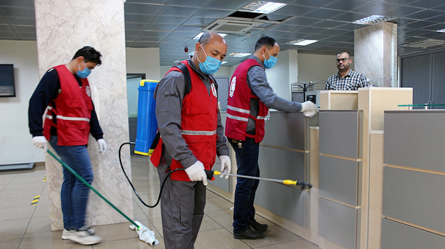 Members of Red Crescent spray disinfectants, as part of precautionary measures 