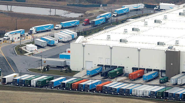 File photo: Amazon.com trucks are seen at an Amazon warehouse on Staten Island in New York City, New York, U.S., March 30, 2020