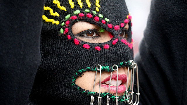 A woman takes part in a demonstration during a global protest against gender violence, in La Paz, Bolivia March 9, 2020. REUTERS/David Mercado

