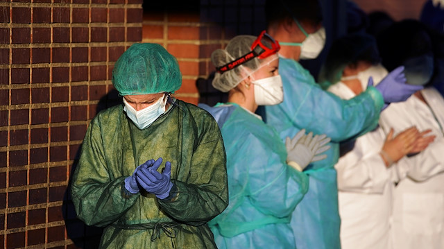 Medical staff of Severo Ochoa hospital applaud in support for healthcare workers, amid the coronavirus disease (COVID-19) outbreak, in Leganes, near Madrid, Spain April 1, 2020