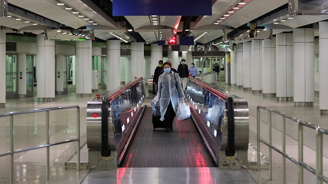 File photo: Passengers wear face masks as they arrive to the Lo Wu MTR station, before the closing of the Lo Wu border following the coronavirus outbreak, in Hong Kong, China February 3, 2020