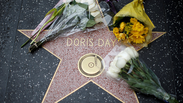 FILE PHOTO: Flowers are pictured by the star of late actor Doris Day on the Hollywood Walk of Fame in Los Angeles, California, U.S.