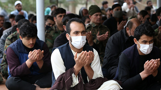 File photo: Muslims wearing protective masks attend Friday prayers at a mosque, amid concerns about the spread of coronavirus disease (COVID-19), in Kabul, Afghanistan March 20, 2020 