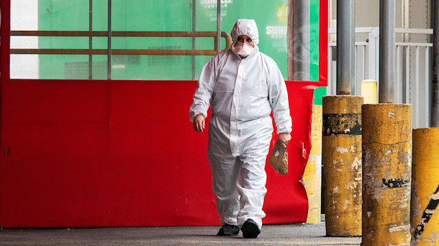 File photo: A person wearing a PPE suit exits the Elmhurst Hospital center as the outbreak of coronavirus disease (COVID-19) continues in the neighborhood of Queens in New York, U.S., April 5, 2020