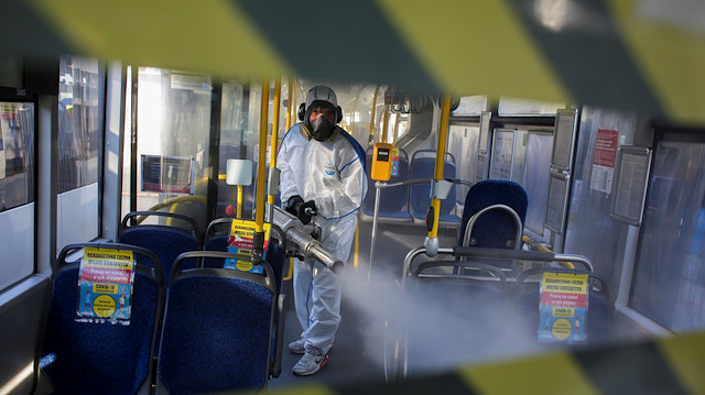 File photo: A worker wearing protective gear disinfects a public bus during the outbreak of the coronavirus disease (COVID-19) in Gdynia, Poland, April 5, 2020