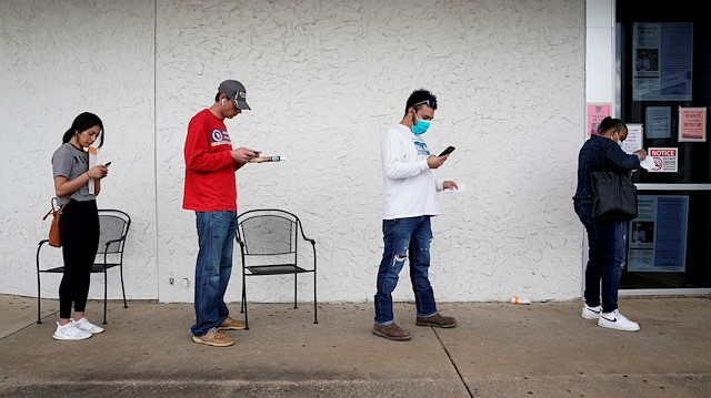 File photo: People who lost their jobs wait in line to file for unemployment following an outbreak of the coronavirus disease (COVID-19), at an Arkansas Workforce Center in Fayetteville, Arkansas, U.S. April 6, 2020