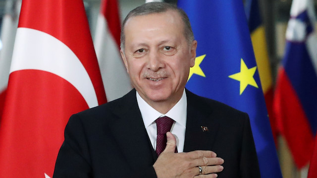 FILE PHOTO: Turkish President Tayyip Erdogan reacts ahead of a meeting with EU leaders in Brussels, Belgium March 9, 2020. REUTERS/Yves Herman/File Photo

