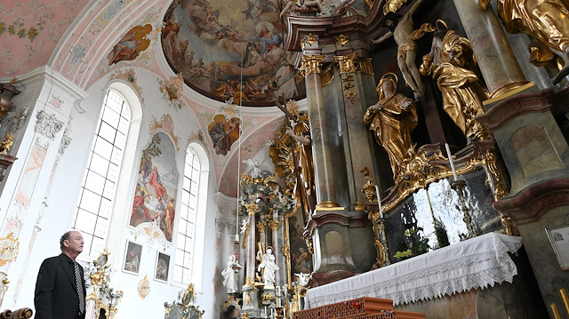 Thomas Groener, pastor from Oberammergau stands inside the Peter and Paul church, as the spread of the coronavirus disease (COVID-19) continues in Oberammergau, Germany, April 9, 2020. REUTERS/Andreas Gebert

