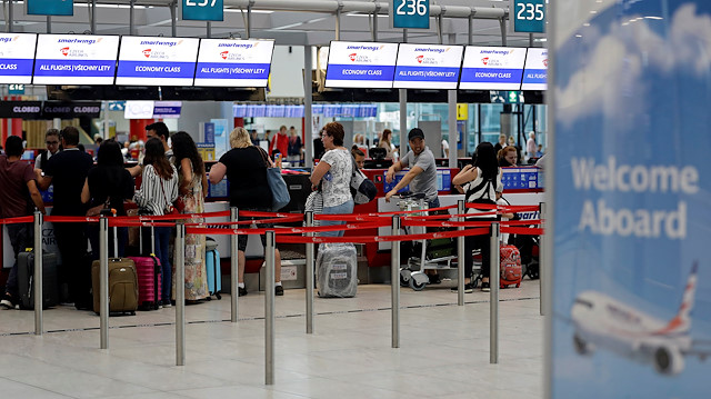 File photo: Passengers queue at check-in counters of Smartwings airline at Vaclav Havel Airport in Prague, Czech Republic, August 20, 2019
