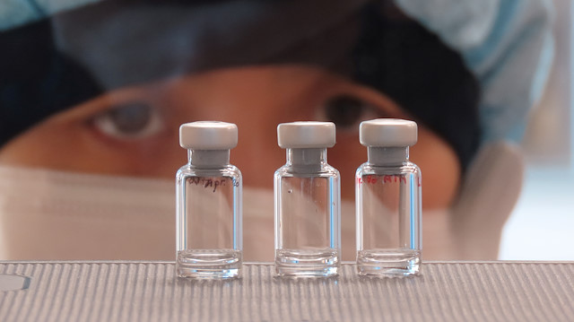 File photo: A scientist checks quality control of vaccine vials for correct volume at the Clinical Biomanufacturing Facility (CBF) in Oxford, Britain, April 2, 2020. Picture taken April 2, 2020