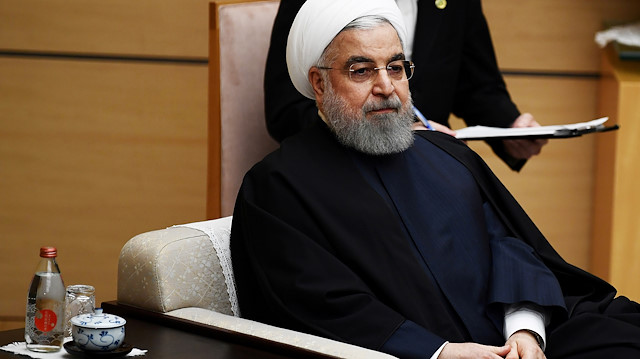 Iranian President Hassan Rouhani takes part in talks during a visit to Tokyo