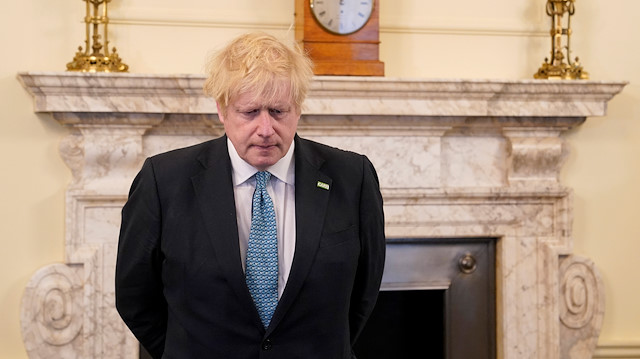 Britain's Prime Minister Boris Johnson observes a minute of silence in a tribute to the NHS staff and key workers who died during the coronavirus disease (COVID-19) outbreak, at 10 Downing Street, London, Britain April 28, 2020